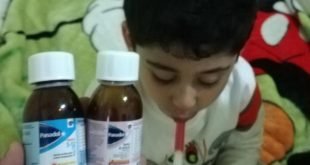 Toddler taking Panadol - طفل يأخذ دواء بانادول